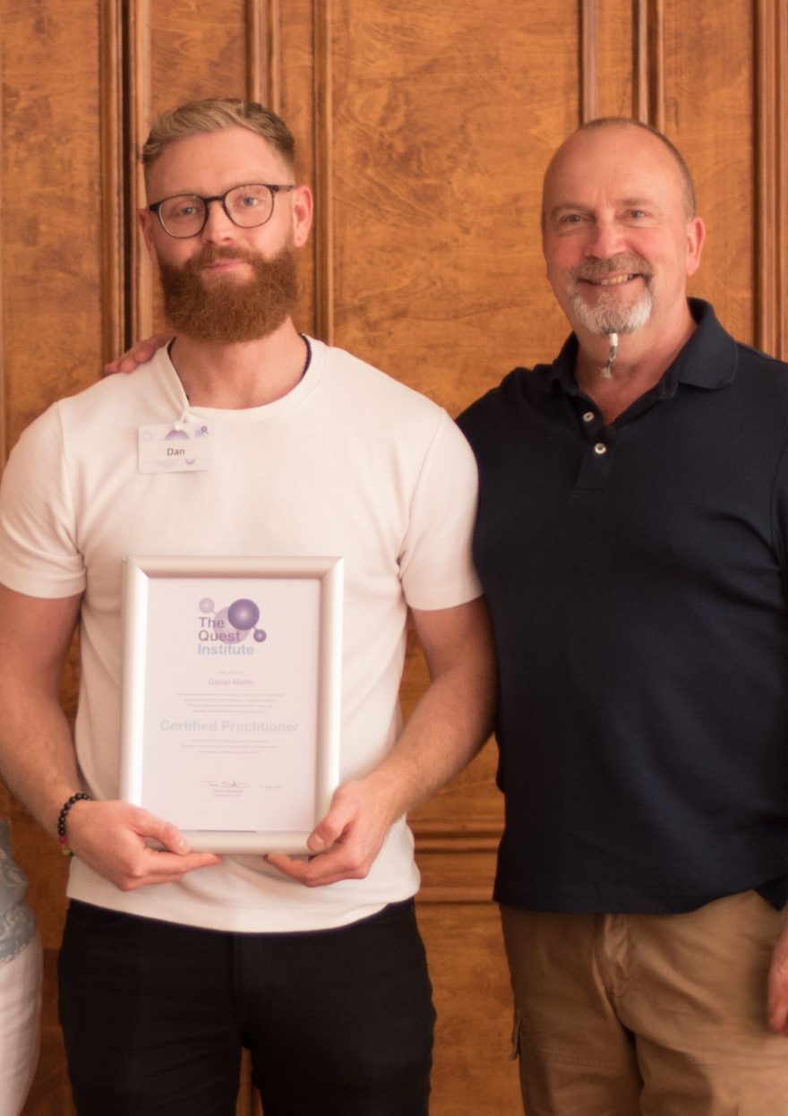 Dan on qualification day holding his Quest Institute certificate